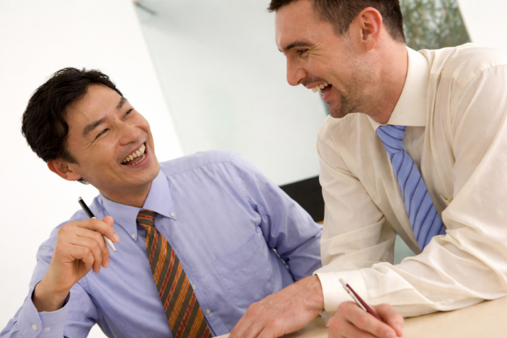 A businessman studying with his teacher