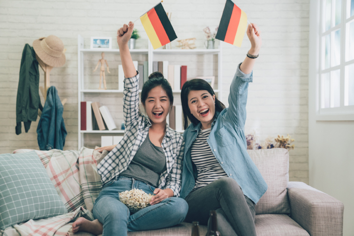 Two women holding German flags